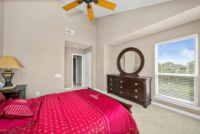 bedroom with light carpet and ceiling fan