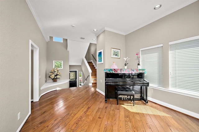 interior space featuring hardwood / wood-style flooring and ornamental molding