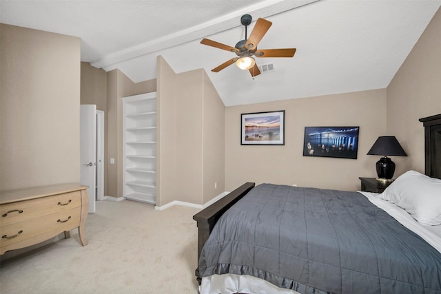 carpeted bedroom with lofted ceiling with beams and ceiling fan