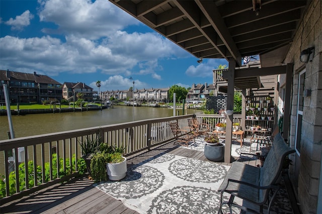 wooden terrace with a water view