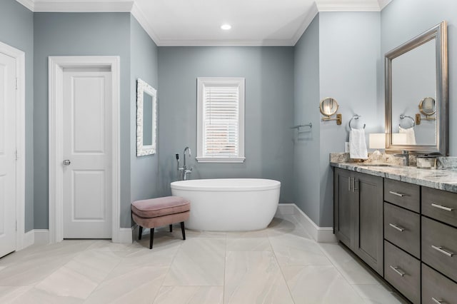 bathroom with vanity, a bath, and crown molding