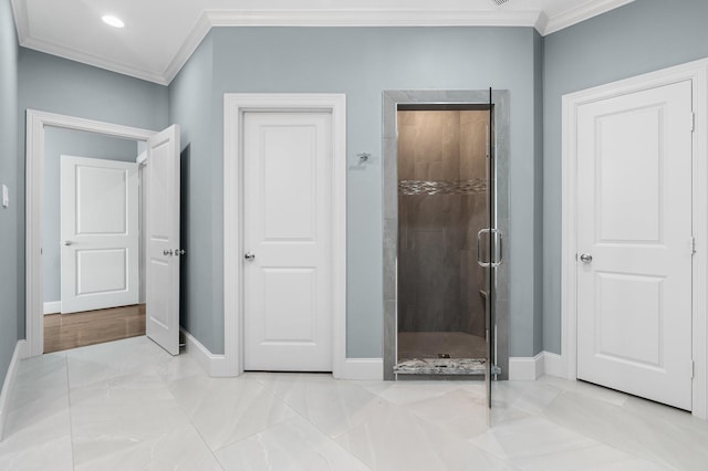 bathroom featuring crown molding and walk in shower