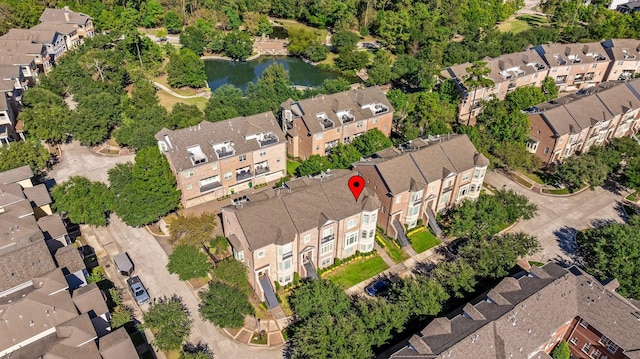 birds eye view of property featuring a water view