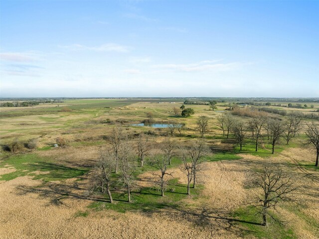 drone / aerial view with a rural view and a water view