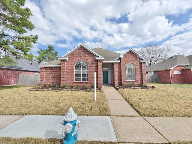 view of front facade with a front lawn