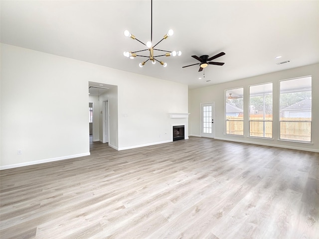 unfurnished living room with ceiling fan and light wood-type flooring