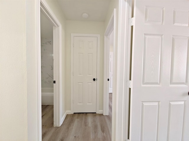 hallway featuring light hardwood / wood-style flooring