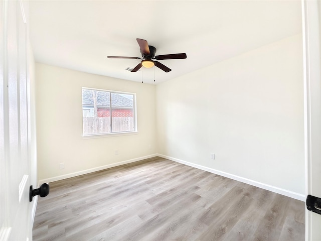 unfurnished room featuring light hardwood / wood-style flooring and ceiling fan