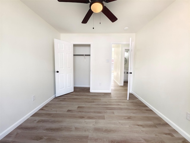 unfurnished bedroom featuring a closet, ceiling fan, and light hardwood / wood-style flooring