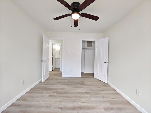 unfurnished bedroom featuring ceiling fan, light hardwood / wood-style floors, and a closet