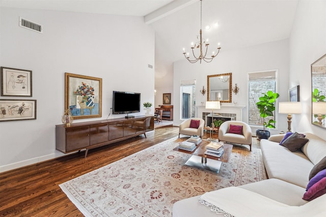 living room featuring a tile fireplace, high vaulted ceiling, a chandelier, dark wood-type flooring, and beam ceiling