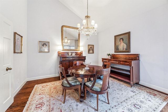 dining area featuring vaulted ceiling, an inviting chandelier, and dark hardwood / wood-style flooring