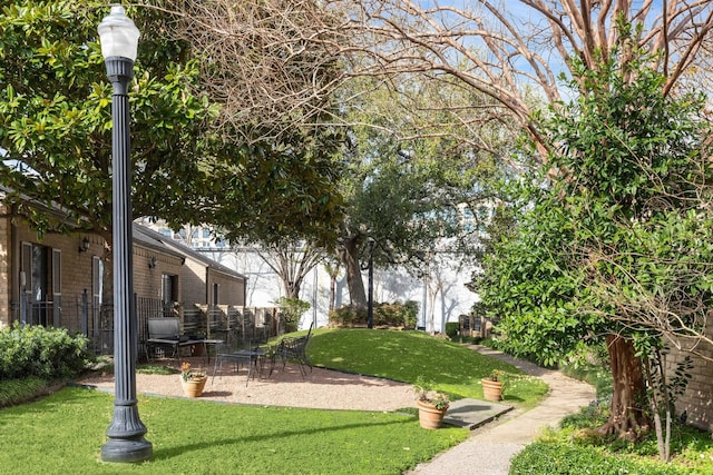 view of property's community featuring a yard