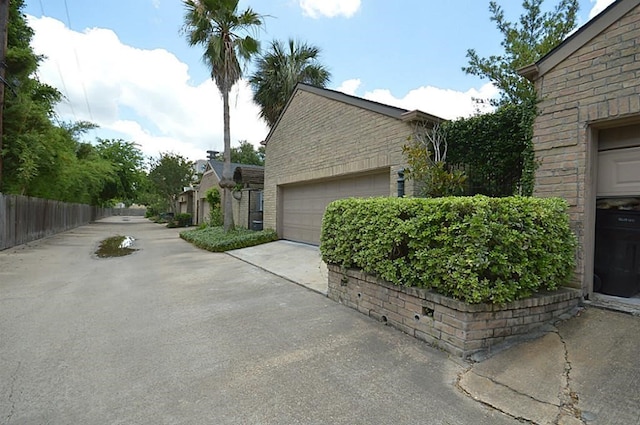 view of side of property featuring a garage