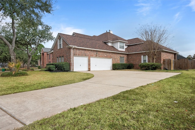 front of property featuring a garage and a front yard