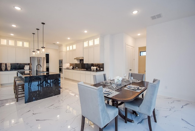 dining space with sink