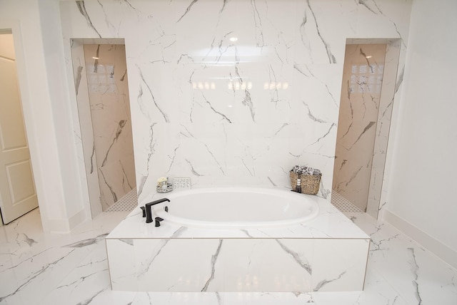 bathroom featuring separate shower and tub