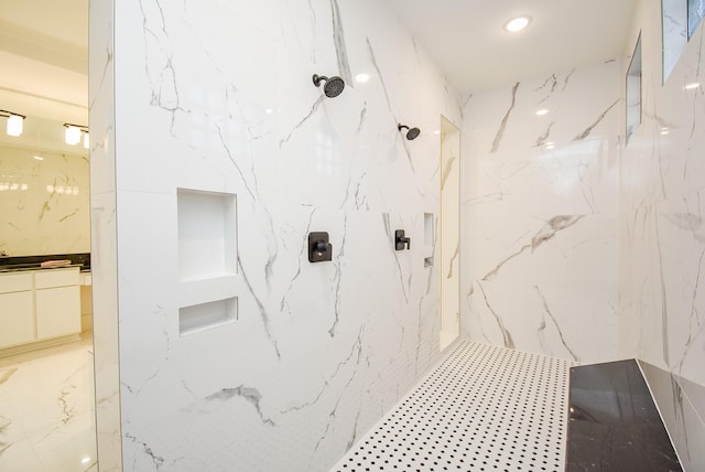 bathroom with a tile shower