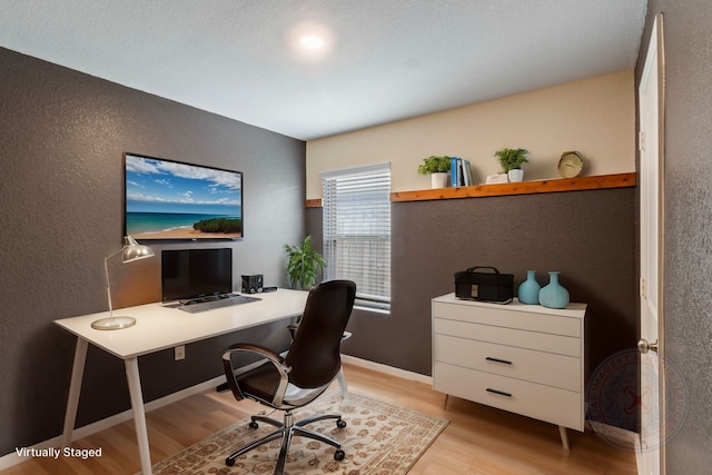 office space with light wood-type flooring