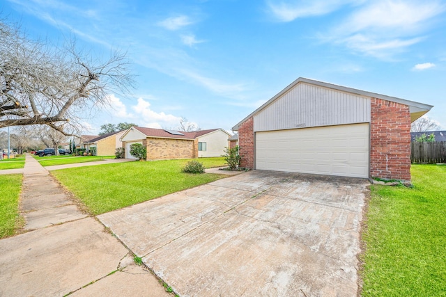 view of front facade with a garage and a front lawn