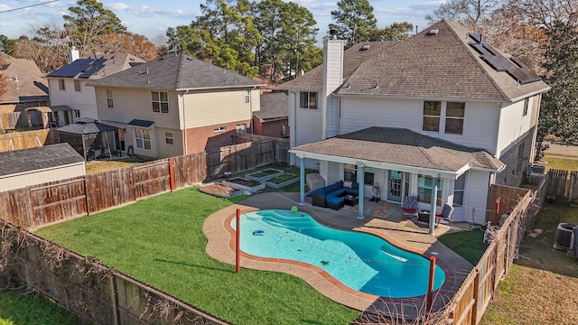 view of pool with a yard and a patio area