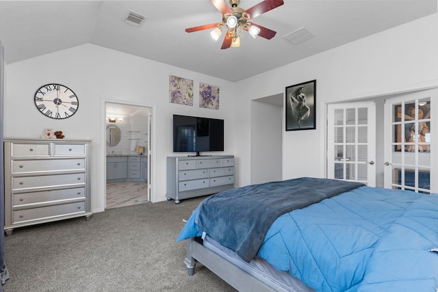 carpeted bedroom with vaulted ceiling, connected bathroom, ceiling fan, and french doors