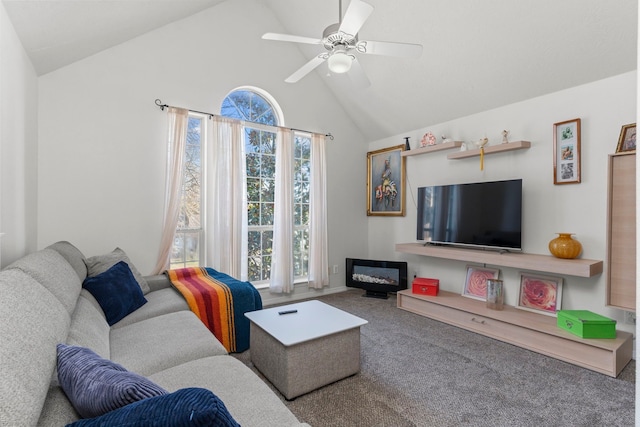 living room with high vaulted ceiling, carpet flooring, and ceiling fan