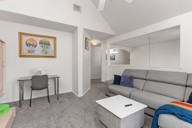 living room featuring ceiling fan with notable chandelier, lofted ceiling, and light carpet