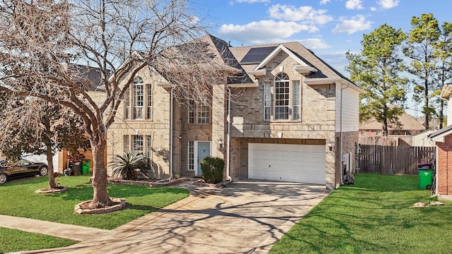 view of front of house with a garage, a front lawn, and solar panels