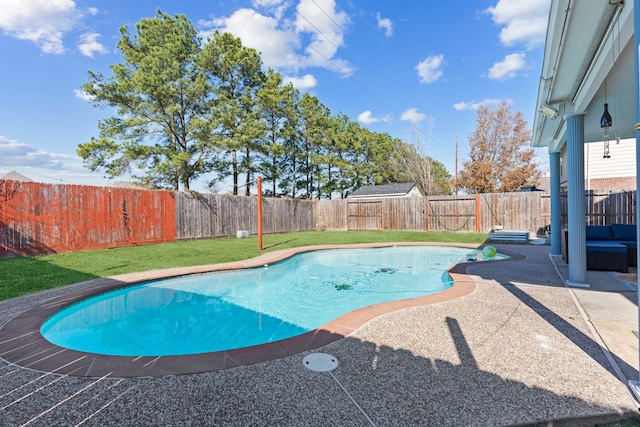 view of swimming pool with a patio area