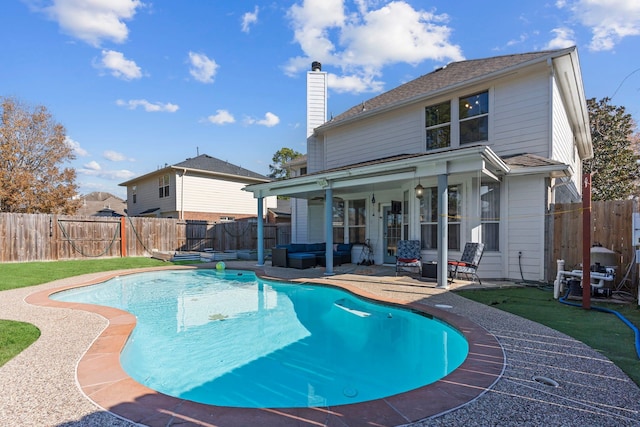 view of swimming pool with a patio and an outdoor hangout area