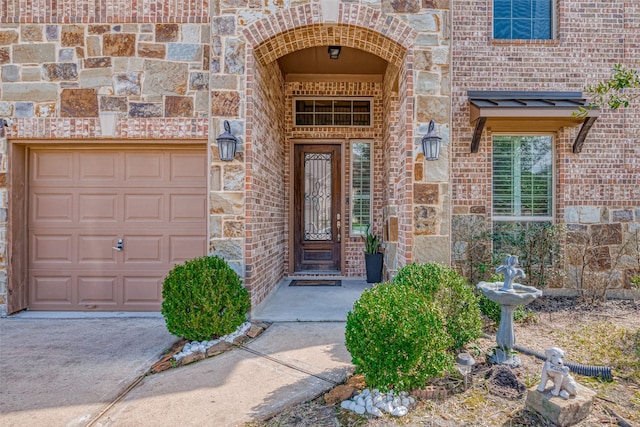 view of exterior entry featuring a garage