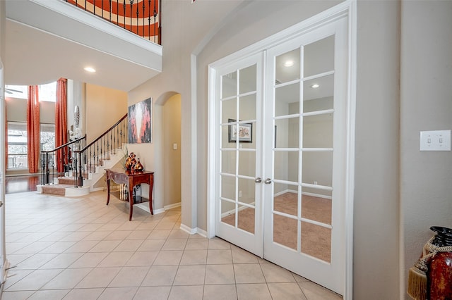 doorway featuring french doors and light tile patterned floors