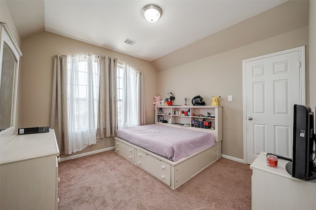 carpeted bedroom featuring vaulted ceiling