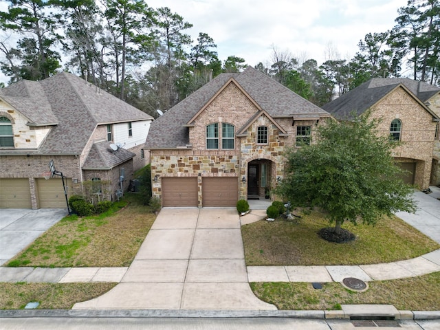 french country inspired facade with a garage and a front lawn