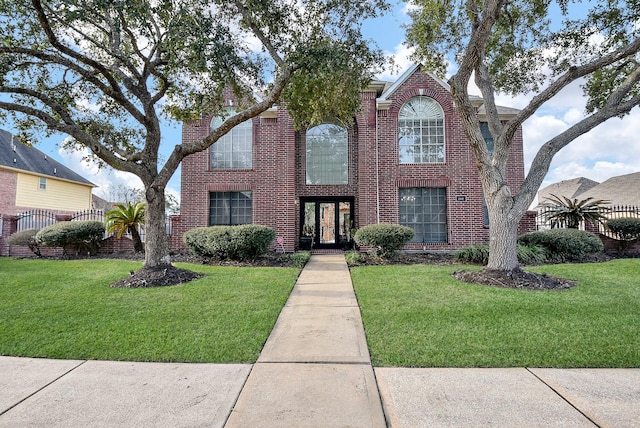 front facade with a front yard