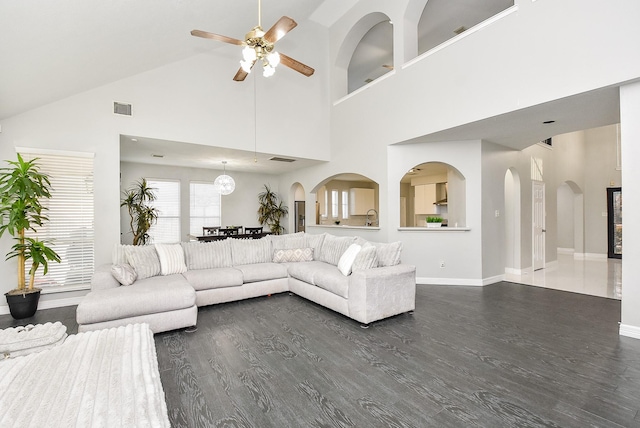 unfurnished living room with dark hardwood / wood-style floors and ceiling fan