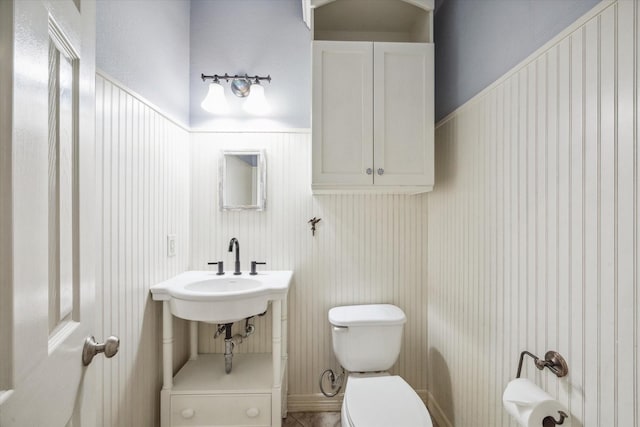 bathroom featuring sink and toilet