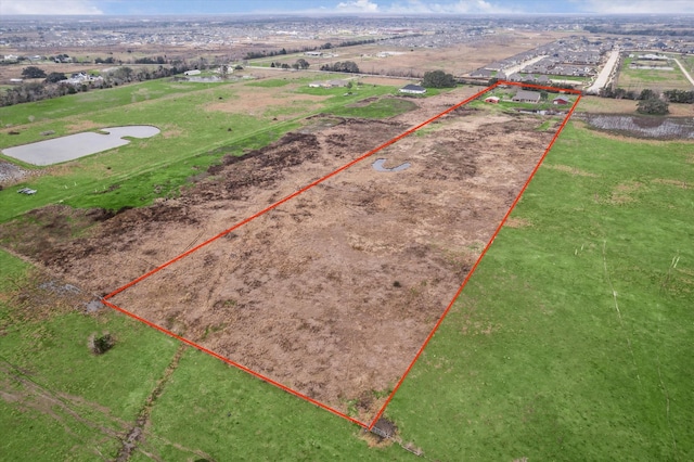 birds eye view of property with a rural view