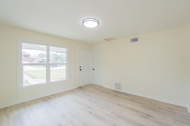 unfurnished room featuring light hardwood / wood-style flooring