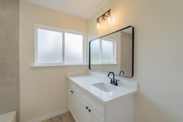 bathroom featuring vanity and hardwood / wood-style flooring