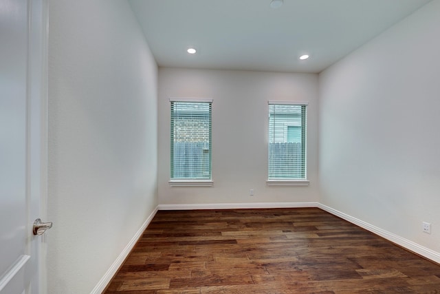 spare room featuring dark hardwood / wood-style floors