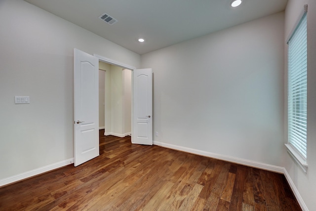 unfurnished bedroom featuring hardwood / wood-style floors