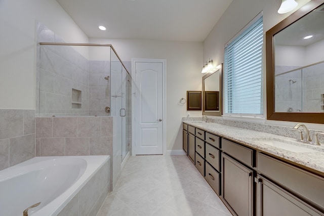 bathroom featuring vanity, separate shower and tub, and tile patterned floors