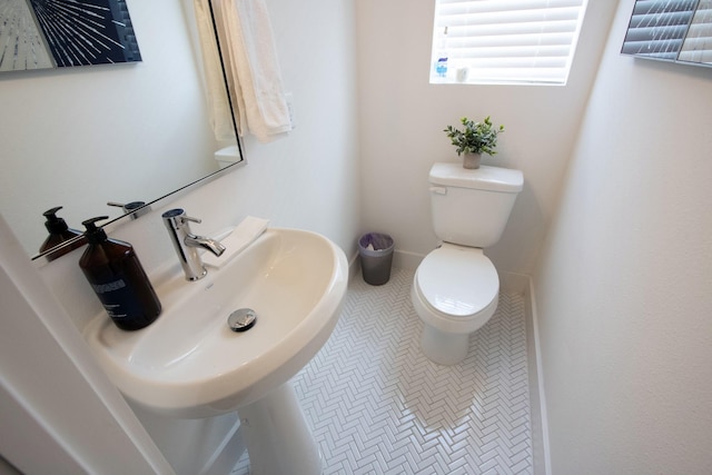 bathroom with sink and toilet