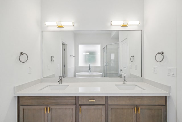 bathroom featuring vanity and shower with separate bathtub