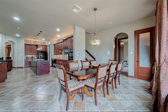 12403 Summer Lake Ranch Dr, Houston, TX 77044 - dining space with recessed lighting, arched walkways, baseboards, and visible vents