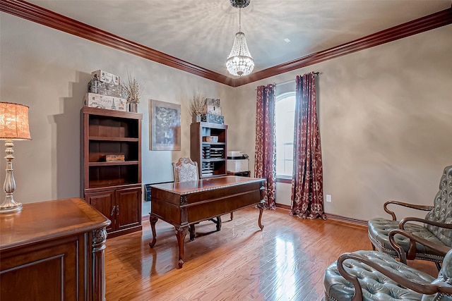 office area with ornamental molding, light hardwood / wood-style floors, and a chandelier