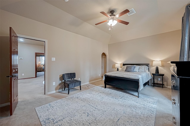 carpeted bedroom with vaulted ceiling and ceiling fan