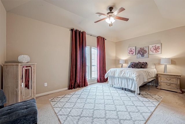 bedroom with ceiling fan and light carpet